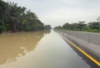 1764479127275-kondisi-banjir-di-tol-belmera-foto-dok-polres-pelabuhan-belawan-1764315065492_169