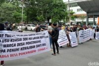 1765796771540-demo-warga-di-usu-1765783464458_169